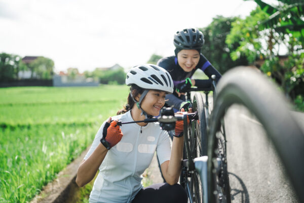 Cyclist using a mini pump